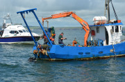 Diver directing lifting of AUD anchor.